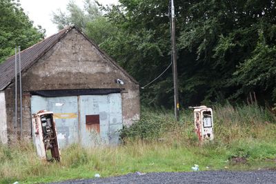 Abandoned house on field