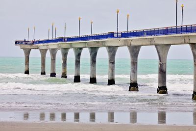 Pier over sea against sky