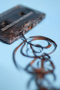 Close-up of damaged audio cassette on table