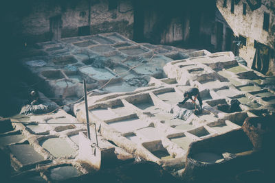 High angle view of people standing at historic building