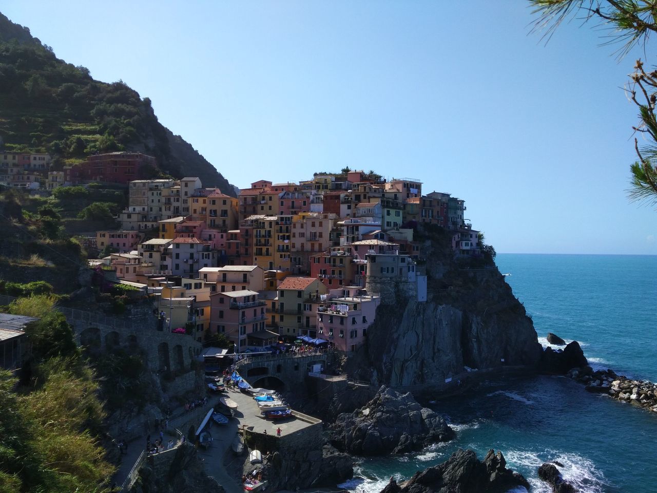 sea, rock formation, rock - object, architecture, building exterior, clear sky, nature, day, no people, water, built structure, cliff, mountain, beauty in nature, outdoors, scenics, travel destinations, sky, horizon over water