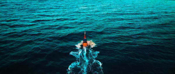 High angle view of man surfing in sea