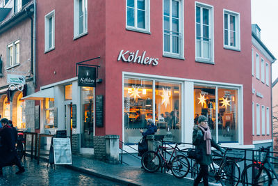 Bicycles on street amidst buildings in city