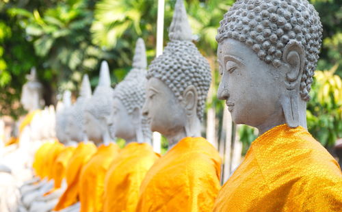 Statue of buddha against temple