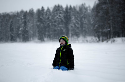 Person standing on snow covered field