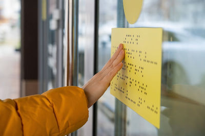 Cropped hand of person holding envelope