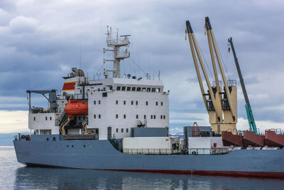 Container vessel unloaded in port on kamchatka peninsula