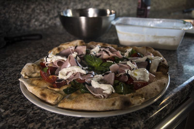 Close-up of pizza in bowl on table