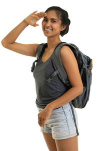 Portrait of a smiling young woman against white background