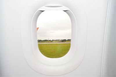 View of field seen through window