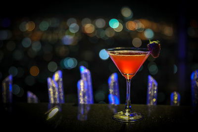 Close-up of wine glasses on bar counter