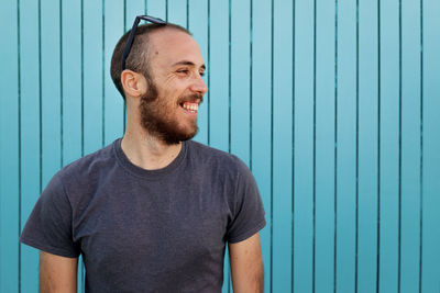 Portrait of smiling young man looking away