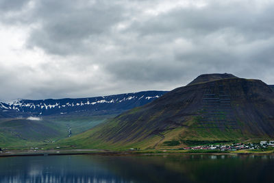 Scenic view of lake and mountains against sky