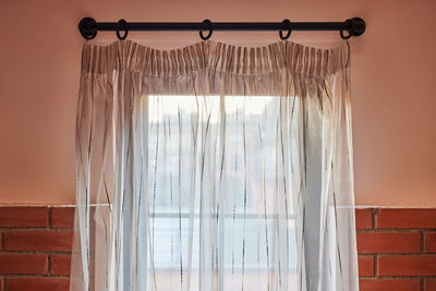 View of curtain by window at home