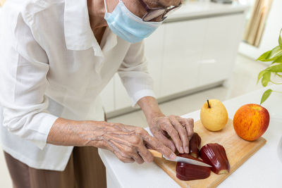 Midsection of chef preparing food