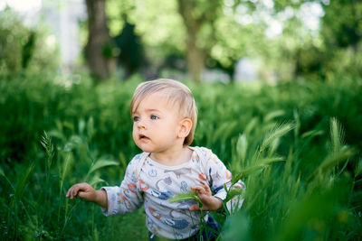 Cute girl against grass at park