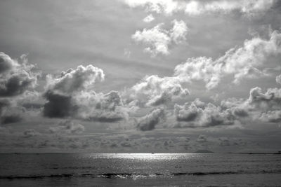 Scenic view of sea against storm clouds