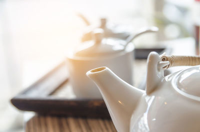 Close-up of tea kettle on table