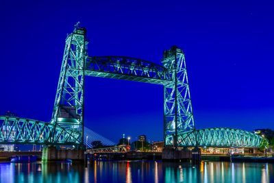 Illuminated bridge over river