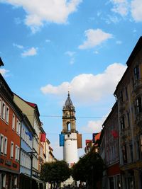 Low angle view of buildings in city against sky