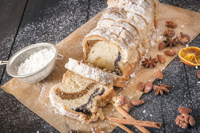 High angle view of sweet food on cutting board at table