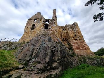 Low angle view of old ruins against sky