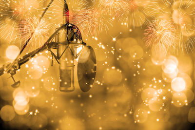 Microphone with defocused lights and firework display