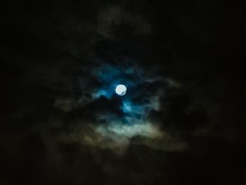 Low angle view of moon in sky at night