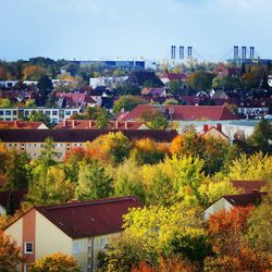 High angle view of trees and buildings against sky