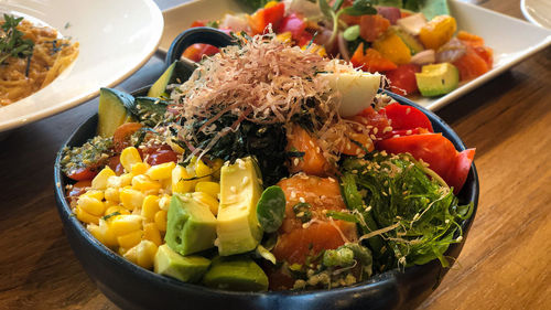 High angle view of chopped vegetables in bowl on table