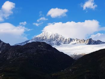 Scenic view of mountains against sky during winter