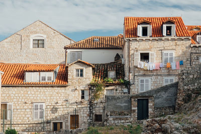 Exterior of abandoned house against sky