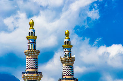 Low angle view of bell tower against sky