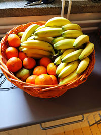 High angle view of fruits in basket on table