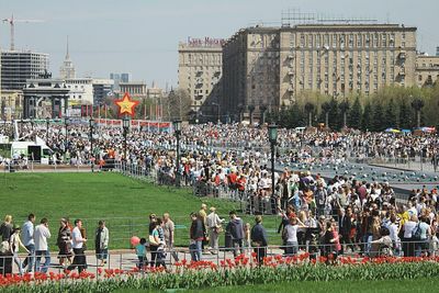 Rear view of people looking at city