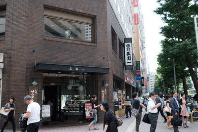 People walking on street in city