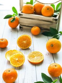 High angle view of orange fruits on table