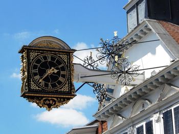 Low angle view of clock tower against sky