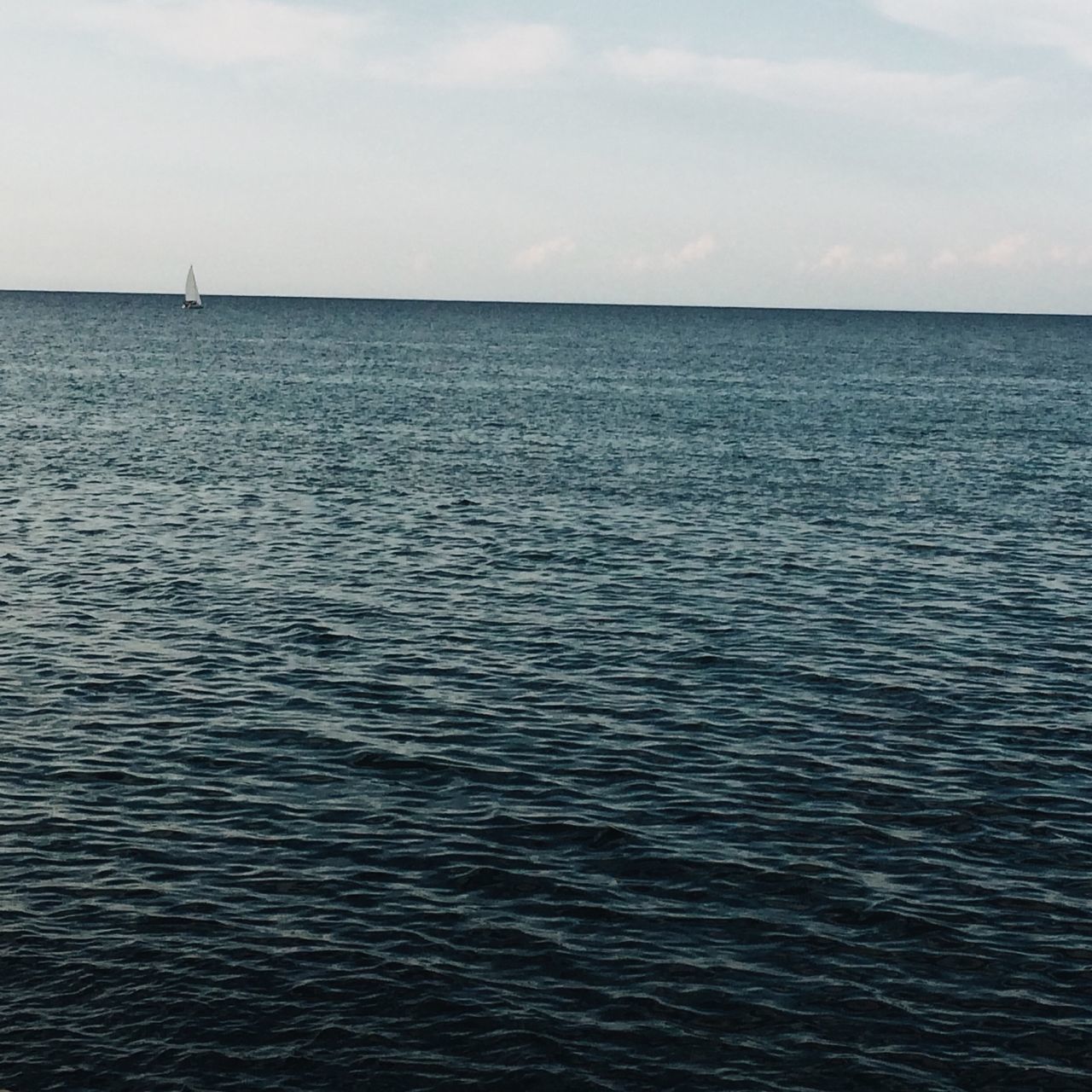 sea, water, horizon over water, waterfront, tranquil scene, sky, rippled, tranquility, scenics, beauty in nature, seascape, nature, nautical vessel, transportation, idyllic, ocean, boat, mode of transport, calm, day