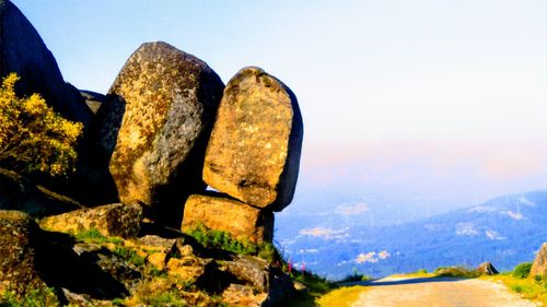 Close-up of stone wall against clear sky