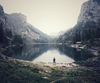 Lake against rocky mountain range