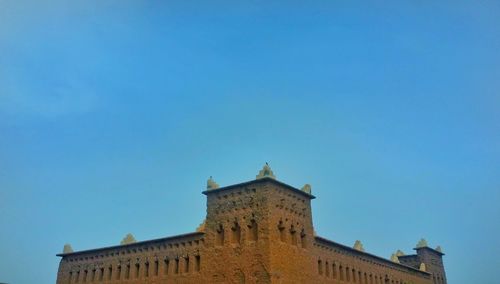 Low angle view of fort against clear sky