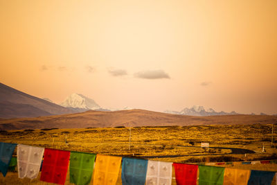 Scenic view of field against sky during sunset