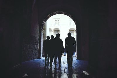 Woman walking in tunnel