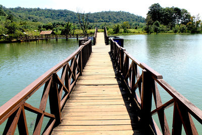 Wooden footbridge over lake
