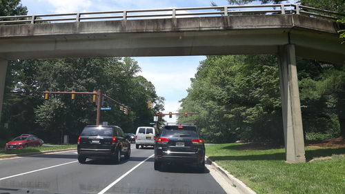 Cars on bridge in city