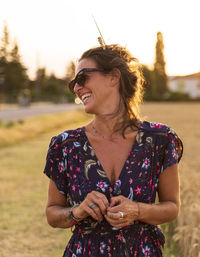 Young woman wearing sunglasses standing outdoors