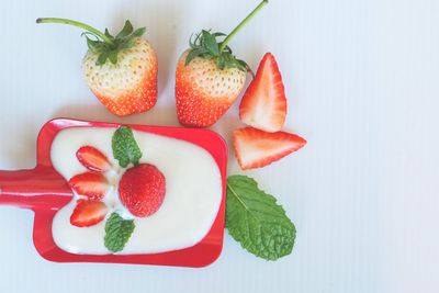 High angle view of fruits in plate on table