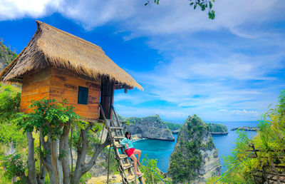 House by sea against sky