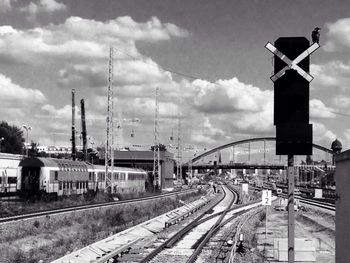 Railroad track against cloudy sky